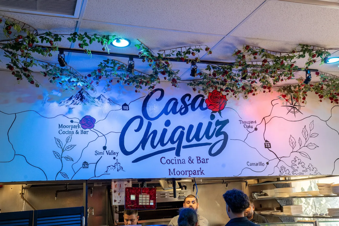 Casa Chiquiz map mural above the open kitchen
